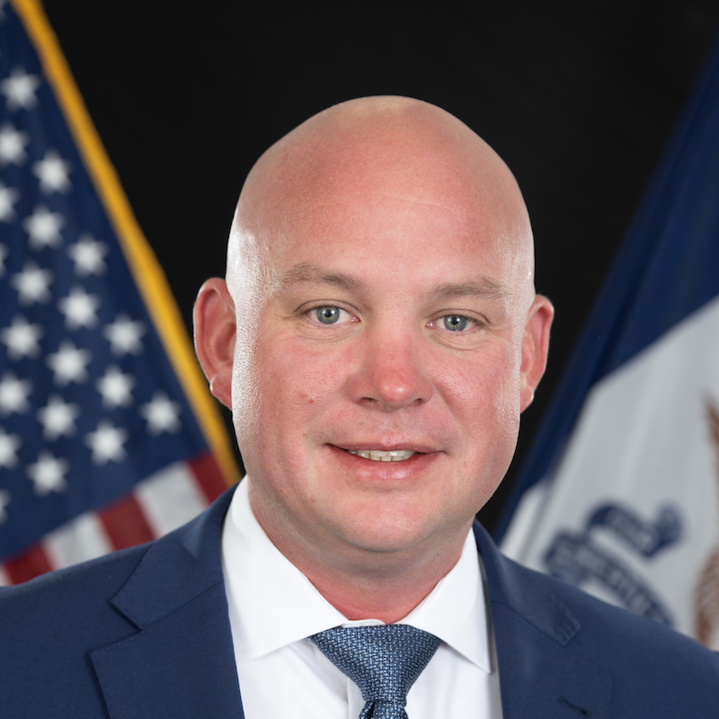 A photo of Mark Bullock, assistant vice president of campus safety, in a blue suit and tie