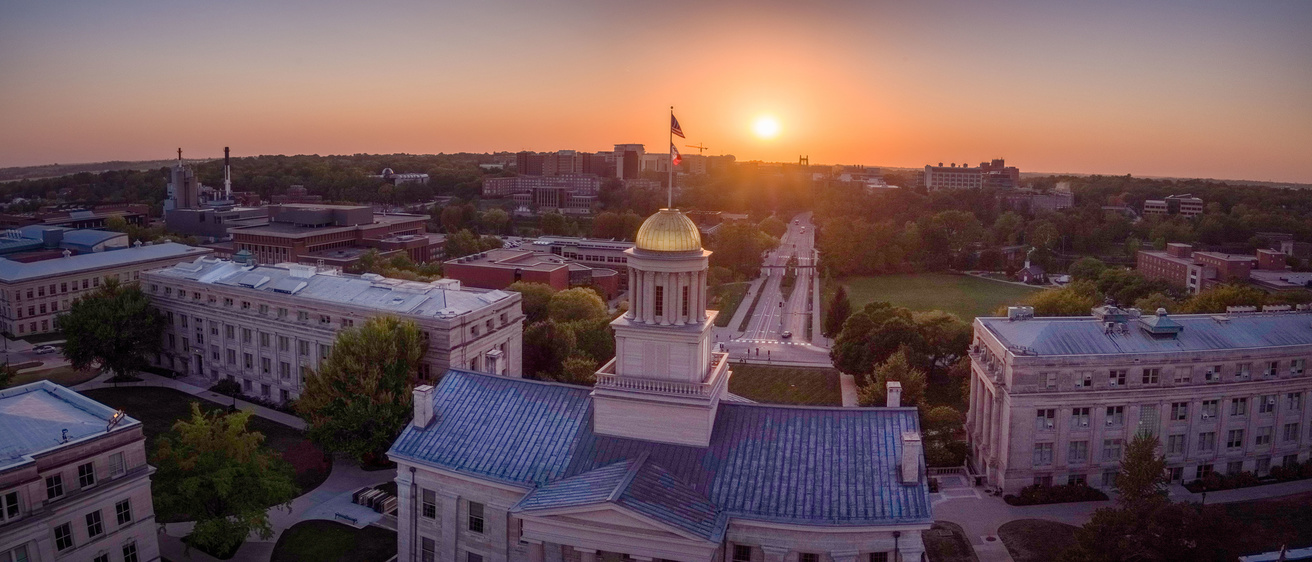 A view of the University of Iowa campus facing west from a drone at dusk