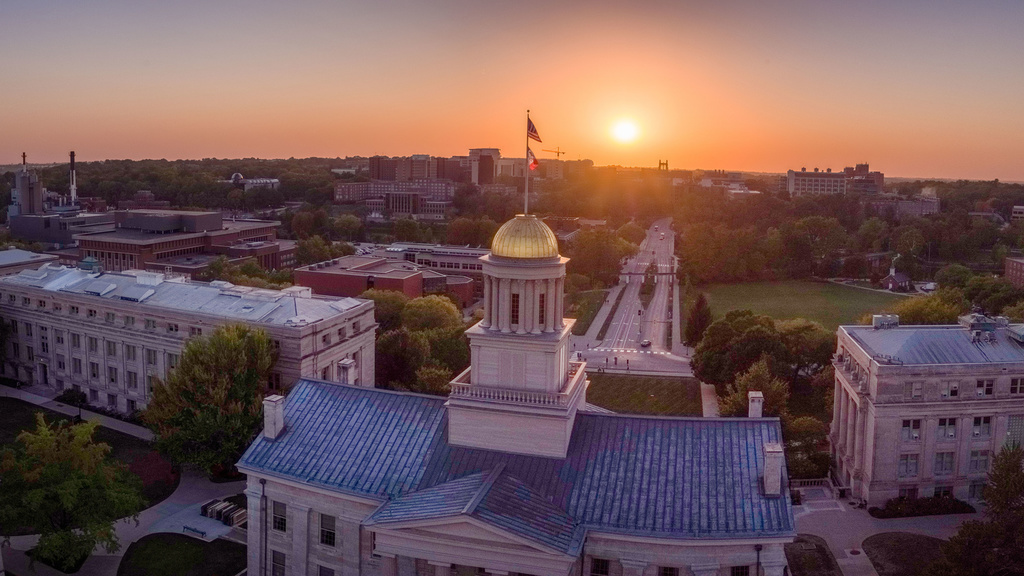 A view of the University of Iowa campus facing west from a drone at dusk